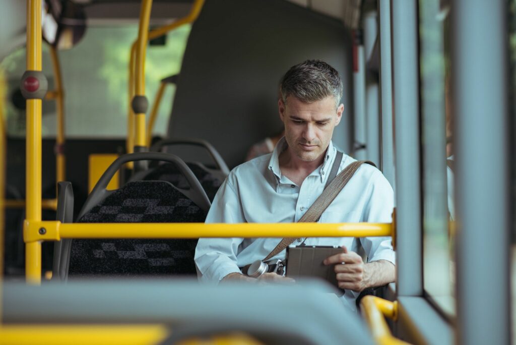 Businessman traveling by bus