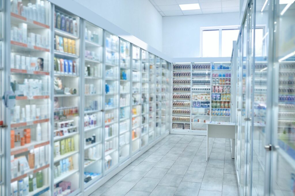 Shelves with medications at a modern pharmacy shop